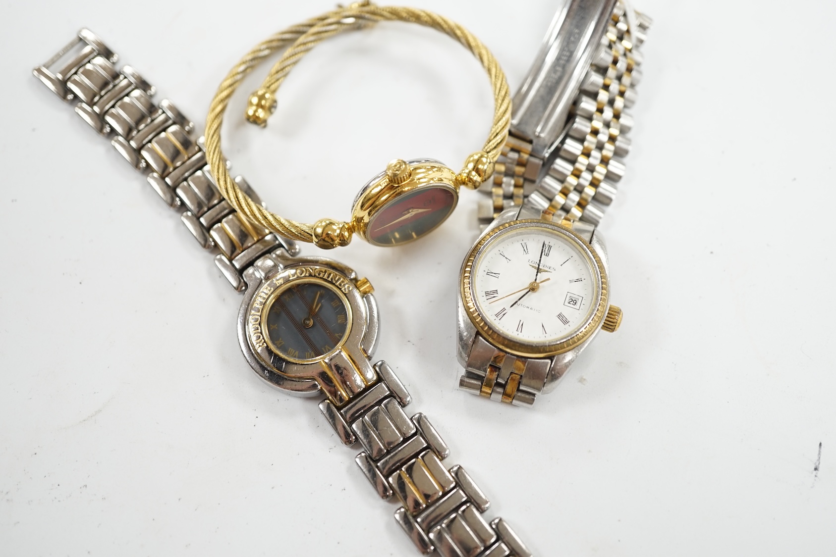 Two lady's steel and gold plated Longines wrist watches, including automatic, and a lady's Gucci wrist watch. Condition - poor to fair